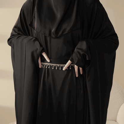 Fabaya UK black 5 piece satin abaya set featuring flowing fabric and decorative waist chain detail