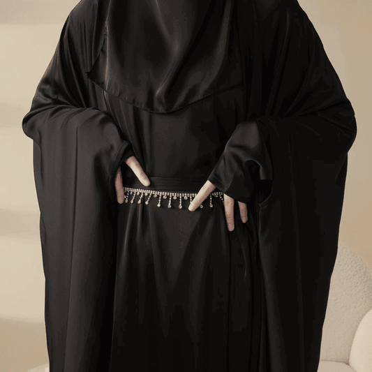 Fabaya UK black 5 piece satin abaya set featuring flowing fabric and decorative waist chain detail