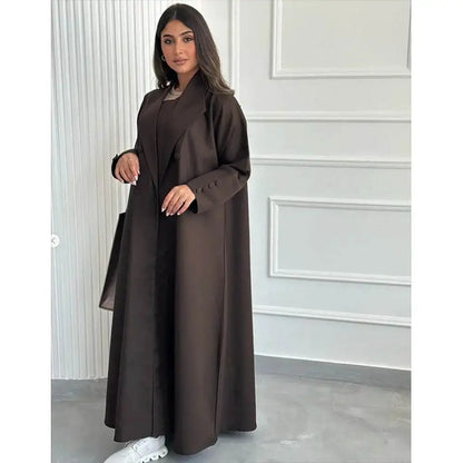 Woman wearing a brown abaya jacket for women by Fabaya UK with long sleeves and button details