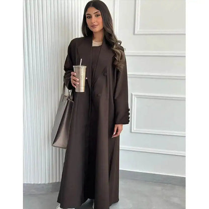 Woman wearing a brown abaya jacket for women by Fabaya UK holding a cup and a handbag