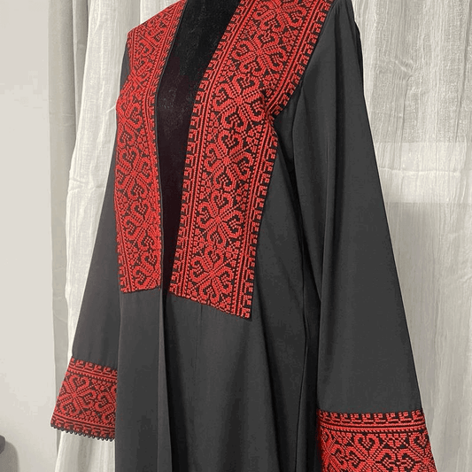 Black chiffon abaya dress for women with intricate red embroidered patterns on front and cuffs