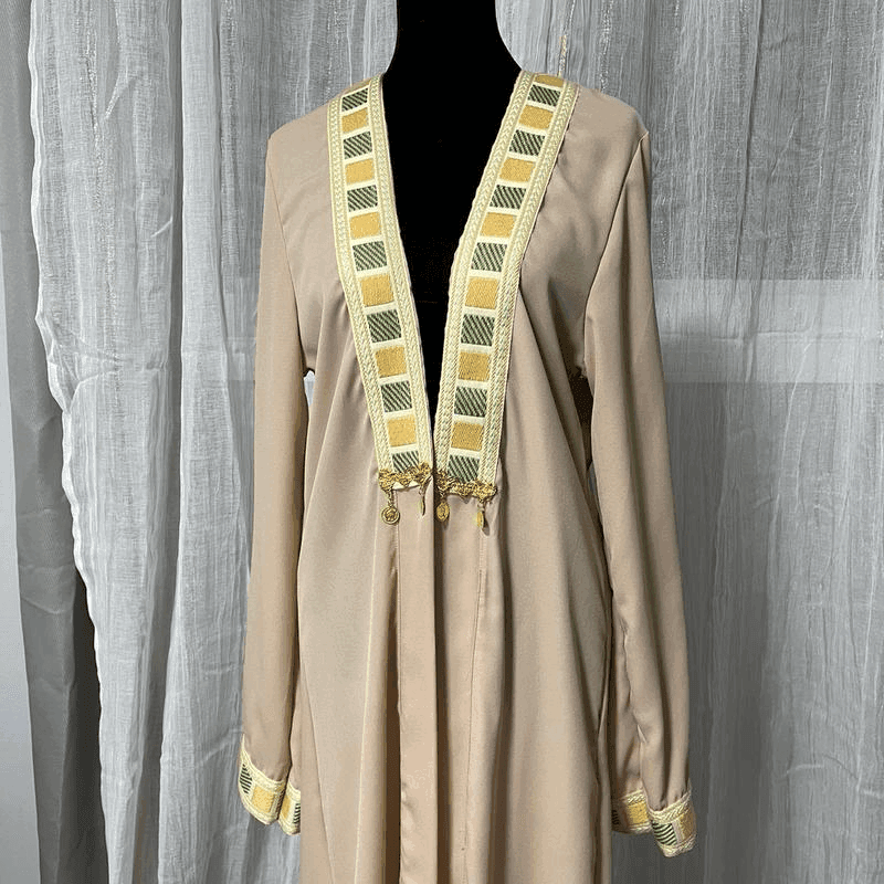Beige chiffon abaya dress for women with decorative yellow and green embroidered trim on collar and cuffs