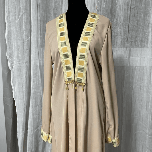 Beige chiffon abaya dress for women with decorative yellow and green embroidered trim on collar and cuffs