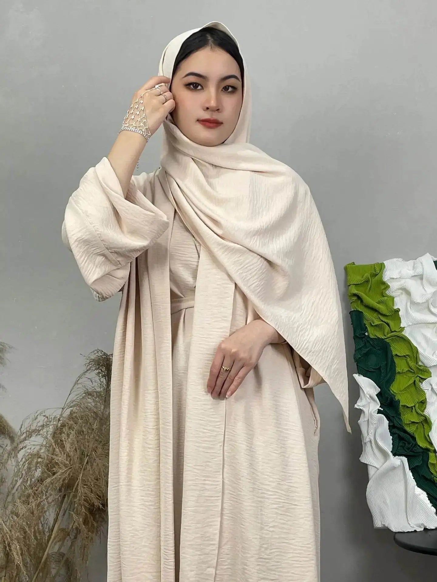 Woman wearing beige cotton linen abaya set with matching hijab by Fabaya UK