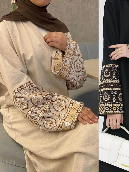 Elegant embroidered abaya kimono with intricate sleeve patterns in beige and black colors from Fabaya UK