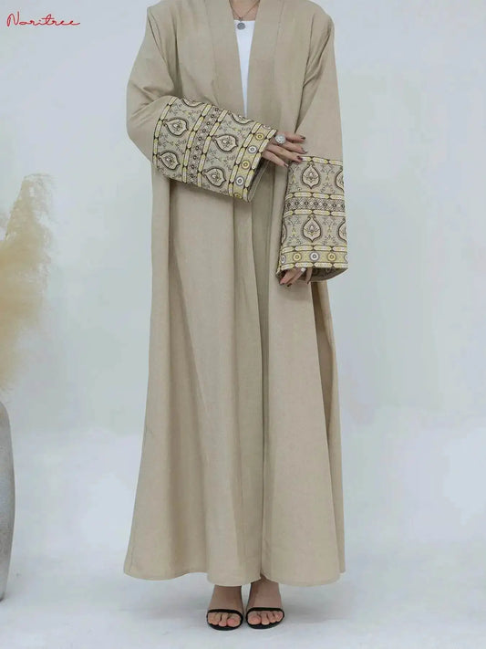Beige embroidered abaya kimono with detailed sleeve designs by Fabaya UK