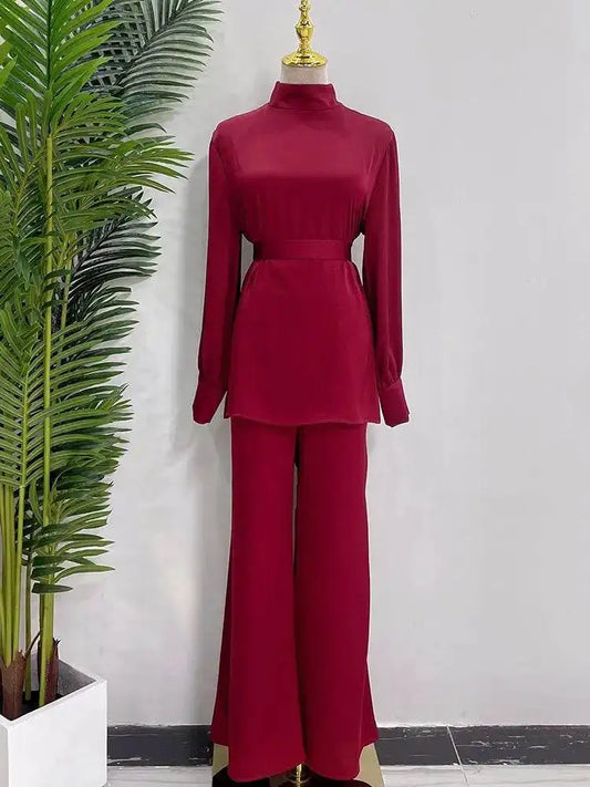Fabaya UK shiny silky abaya set in deep red with long sleeves and high neckline on mannequin