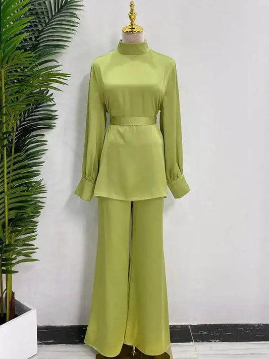 Fabaya UK shiny silky abaya set in light green with long sleeves and wide-leg pants on mannequin