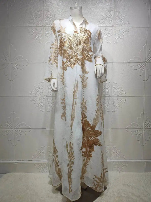 White Moroccan embroidered abaya dress with gold floral patterns on a mannequin by Fabaya UK