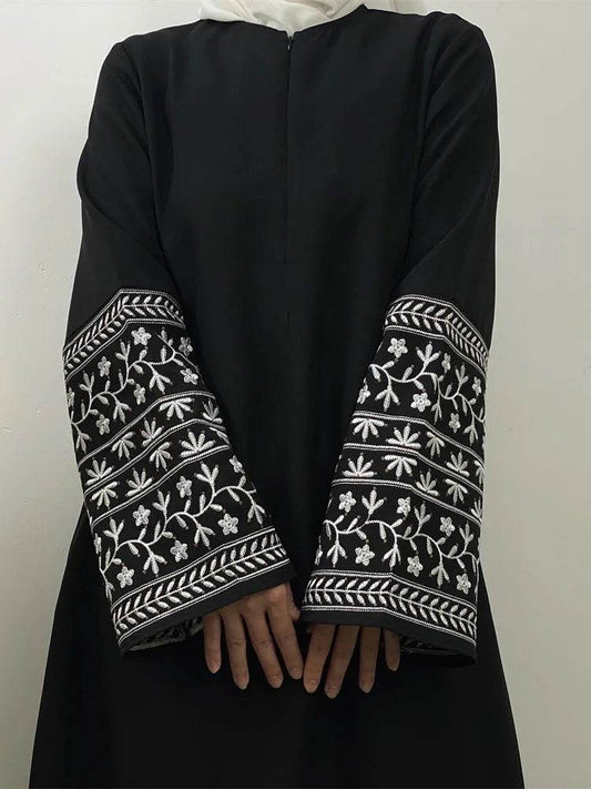 Black Fabaya UK stylish muslim abaya for women with detailed white floral embroidery on sleeves