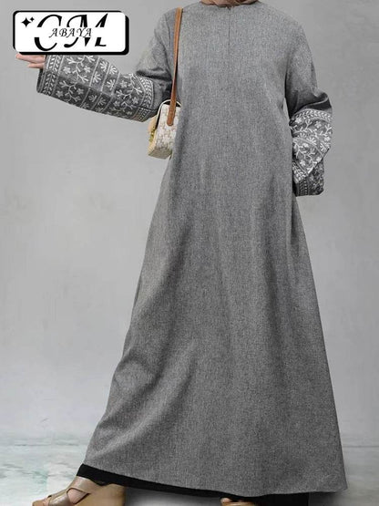 Stylish muslim abaya for women in grey with embroidered wide sleeves and a modest design