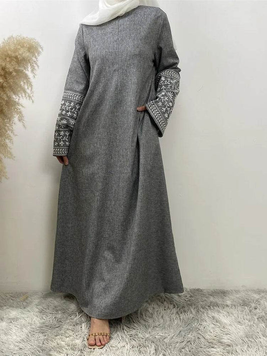 Stylish muslim abaya for women in gray with embroidered sleeves and modest full-length design